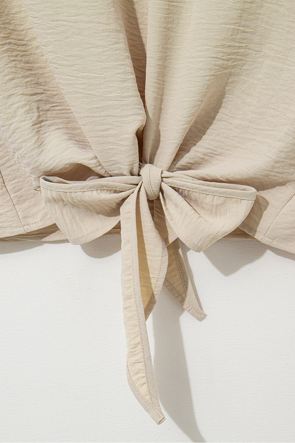 Parchment Solid Color Knotted Hem Short Sleeve Blouse