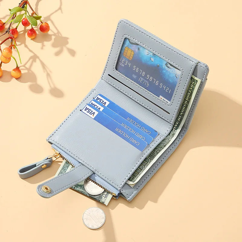 Light blue wallet with cards and money