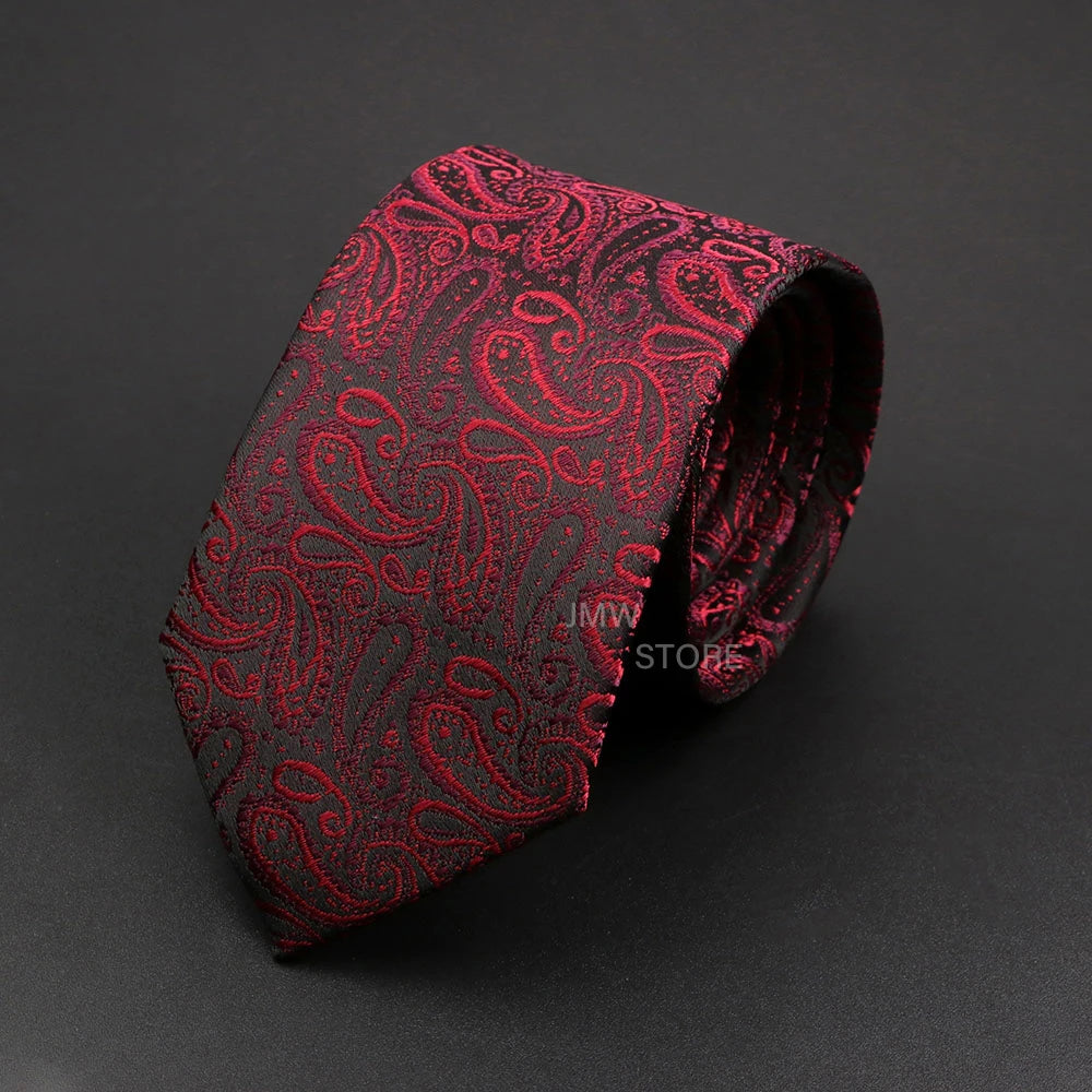 Red paisley patterned tie on a dark gray background