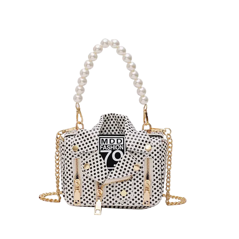 Polka dot handbag with gold chain and pearl handle on a white background
