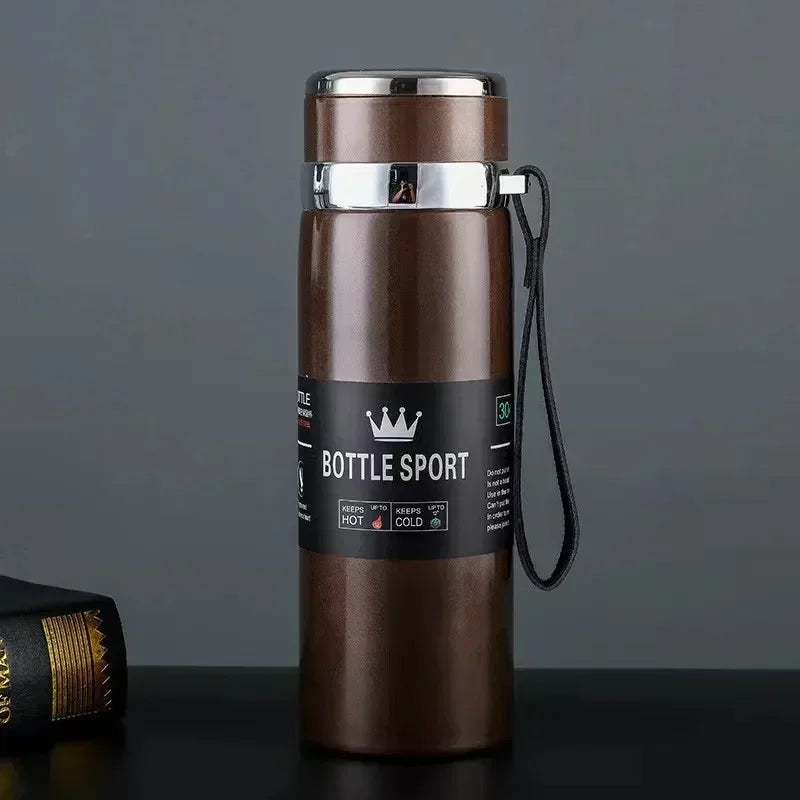 Brown insulated bottle with 'Bottle Sport' label on a dark surface