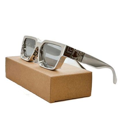 Carauana Millionaire GO with reflective lenses on a brown box
