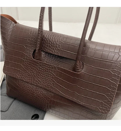 Carauana Crocodile Leather Handbag BROWN on a light gray background